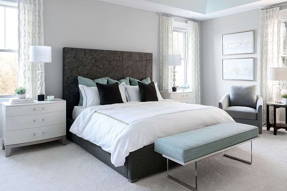 A dark cork headboard offsets the pale ocean colors of the other furnishings in this new luxury bedroom. 